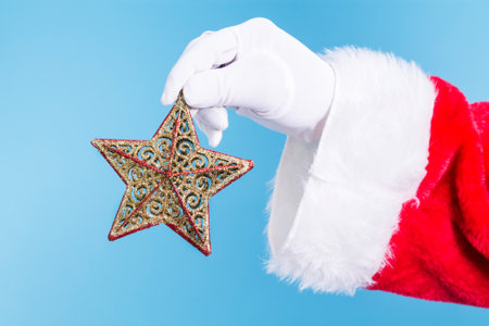 Santa Claus with a Christmas star in his handの写真素材