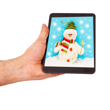 hand with tablet close up with christmas message