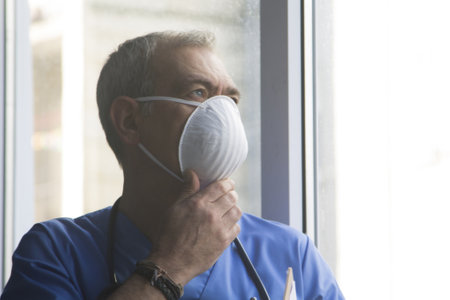 doctor with mask, stethoscope and reports, coronavirus virus concept and infectionsの写真素材