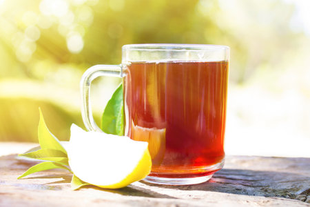 hot red tea cup with lemonの写真素材