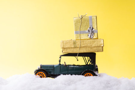 Car on snow with gift packages. Merry Christmas and Happy New Year