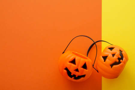 Pumpkins on yellow and orange background. Halloween party