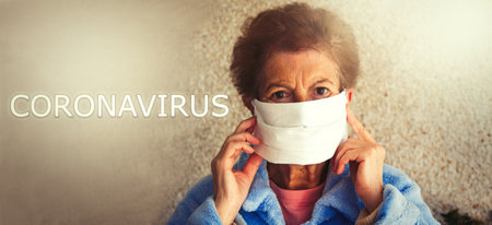 portrait of senior woman with disposable medical mask. Safety in public places during  outbreak.の写真素材