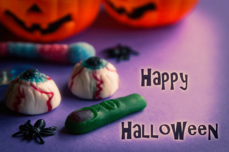 halloween candies with orange pumpkin in the backgroundの写真素材