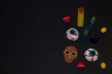halloween candies seen close up on dark backgroundの写真素材