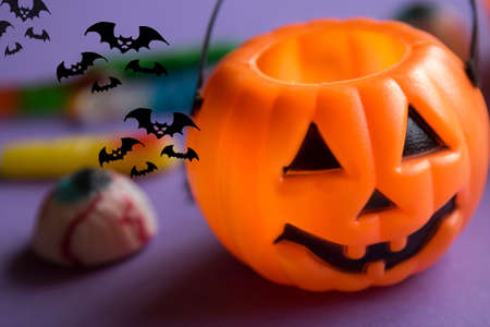 halloween candies with orange pumpkin in the backgroundの写真素材