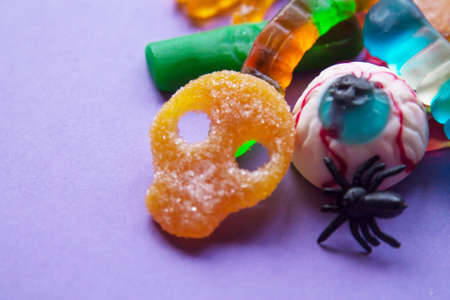 halloween candies seen close up on purple backgroundの写真素材
