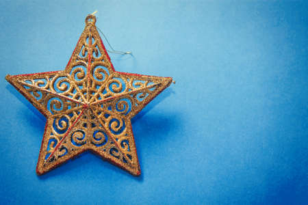 Christmas star on blue background. Christmas greetingの写真素材