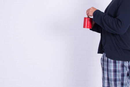 man with cup of coffee isolatedの写真素材