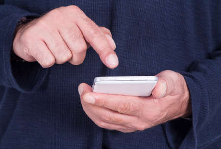 man using mobile phone closeup view