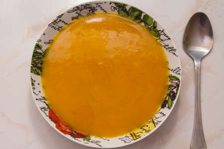 bowl with pumpkin soup on backgroundの写真素材