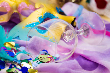 glass cup full of confetti and carnival masks, happy carnivalの写真素材