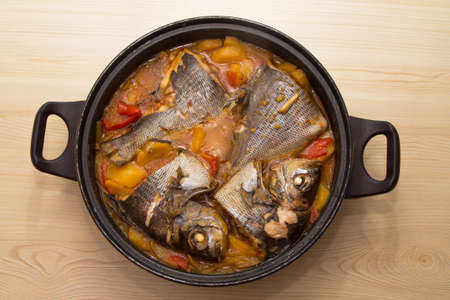 fish casserole with potatoes and peppersの写真素材