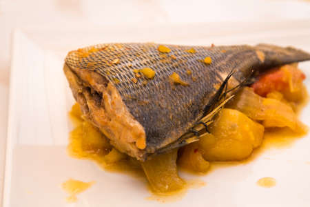 Stewed fish with baking potatoes and peppersの写真素材