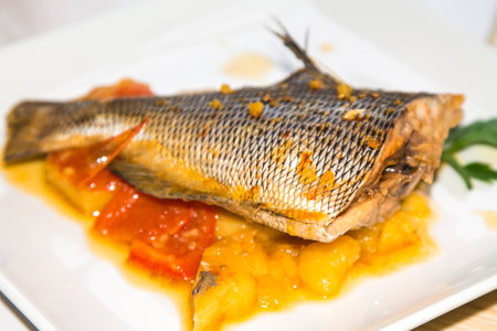 stewed fish dish with potatoes and peppersの写真素材