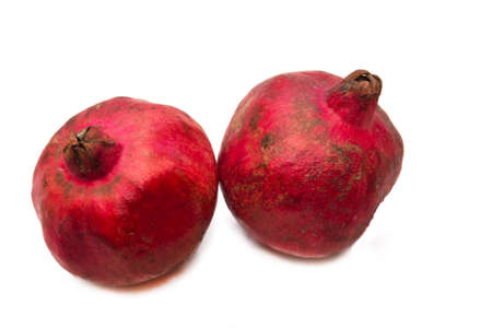 winter fruit, red pomegranate isolated on whiteの写真素材