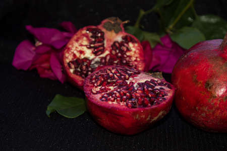 pomegranate fruit on black backgroundの写真素材
