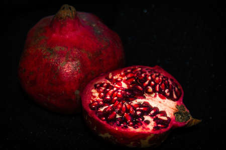 pomegranate fruit on black backgroundの写真素材