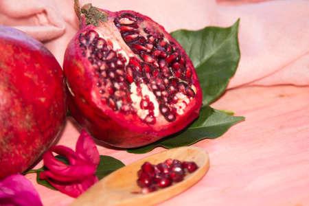 pomegranate fruit on pink backgroundの写真素材