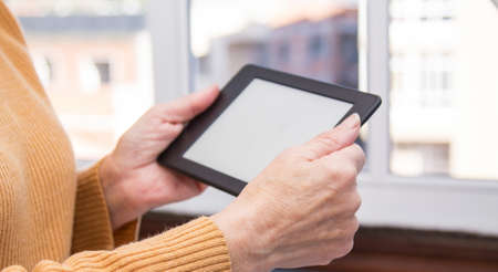 woman's hands working with digital tabletの写真素材