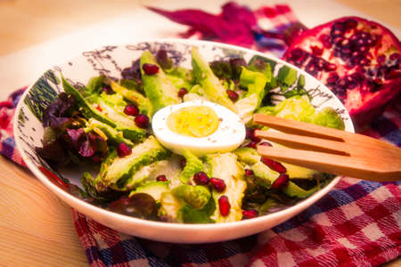 lettuce, avocado and pomegranate salad, diet and health conceptの写真素材