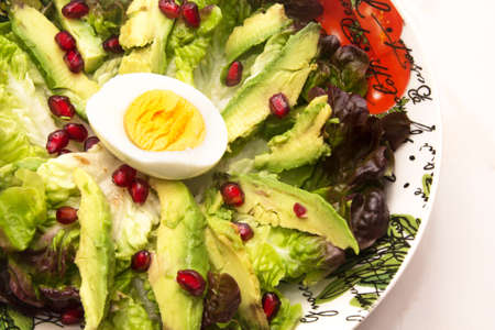 salad with lettuce and avocado, diet and food conceptの写真素材