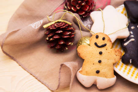 Gingerbread man and gingerbread cookie on bokeh background. Christmas banner.