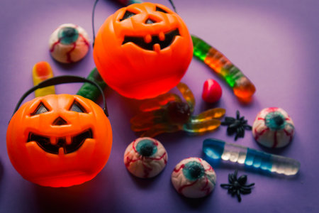 halloween candies seen close up on lilac backgroundの写真素材