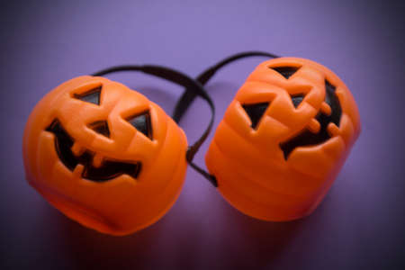 pumpkin shaped bags with purple background, happy halloweenの写真素材