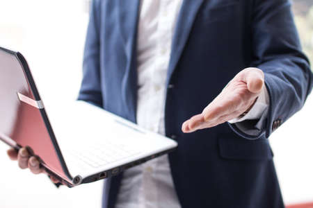 businessman doing demonstration with his pcの写真素材