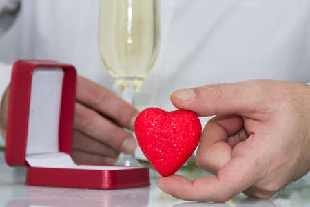 celebration of February 14 Valentine's Day with champagne and heart in hand