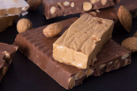 Almond nougat, typical Christmas dessert on background