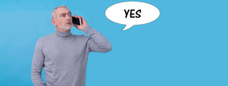 adult man talking on the mobile phone isolatedの写真素材