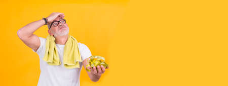 attractive man with scale and tape measure, diet and health conceptの写真素材