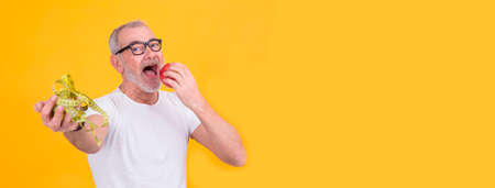 attractive man with scale and tape measure, diet and health conceptの写真素材