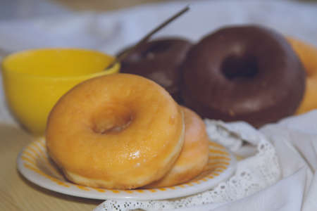 cup of coffee and delicious donuts on the tableの写真素材