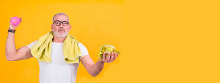 adult man with towel and measuring tape doing ok sign, health and sport conceptの写真素材