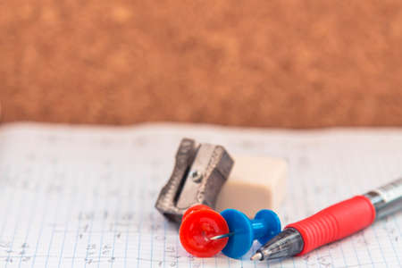 school or office supplies, notebook, drawing pins, pencil, pencil sharpener, eraser