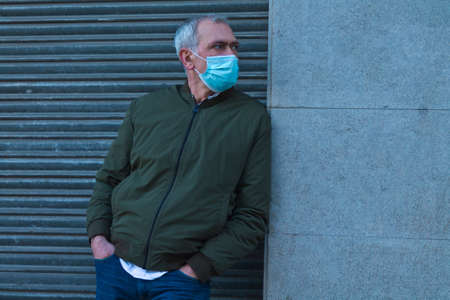 casual adult man with medical maskの写真素材