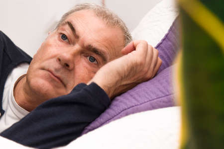 man in bed with insomnia or sleeplessの写真素材