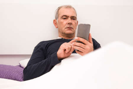 man in bed with insomnia or sleepless