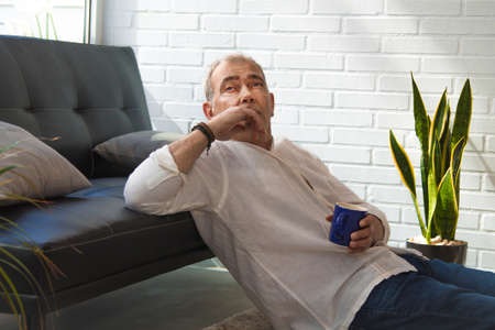 middle-aged man with laptop and credit cardの写真素材