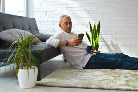 middle-aged man with laptop and credit cardの写真素材