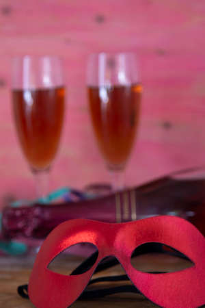 mask and wine glasses on the table. happy carnival conceptの写真素材