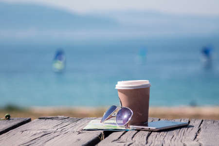 holiday concept. Takeaway, map and sunglassesの写真素材