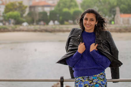 portrait of young latin woman in marina