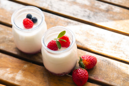 dairy dessert - yogurt with fresh strawberries in a glassの写真素材