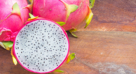 Fresh dragon fruit on wooden backgroundの写真素材