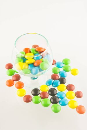 colorful candy in glass on whitegroundの写真素材