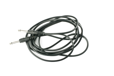 Guitar audio jack with black cable isolated on white backgroundの写真素材